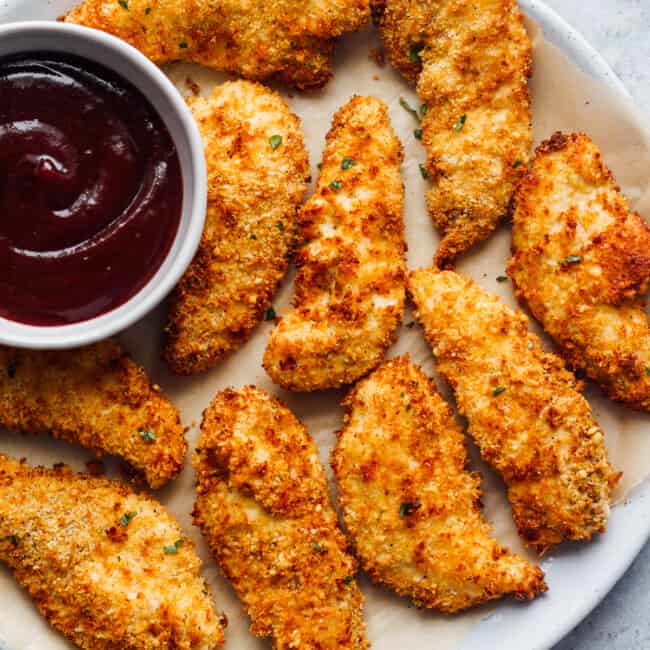 air fryer chicken tenders on plate with bbq sauce