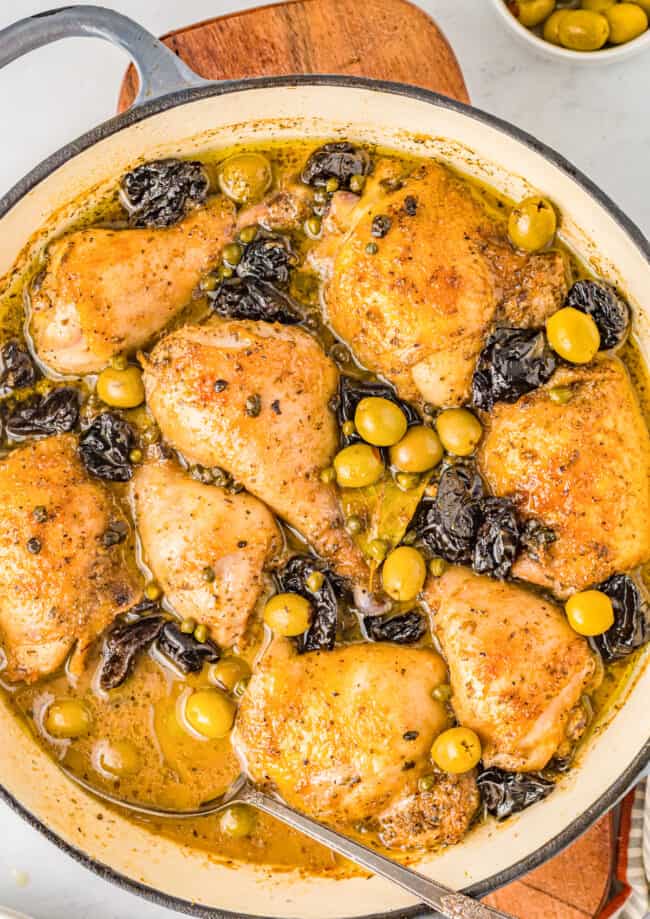 chicken marbella in a round pan.