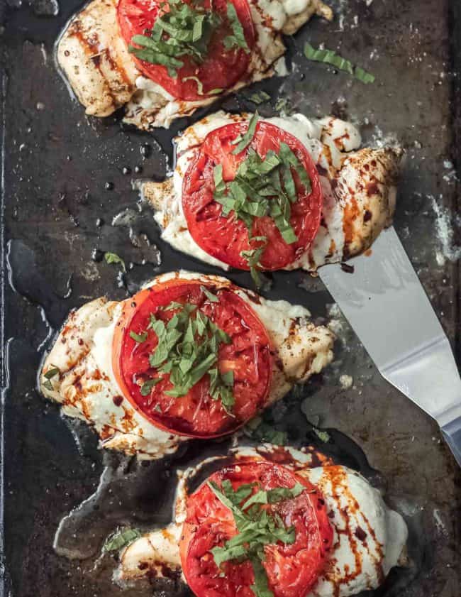 This Sheet Pan Chicken Caprese recipe is quick, easy, and even a little bit fancy. Easy Caprese Chicken is the perfect easy chicken recipe for busy weeknights! Five basic ingredients and one sheet pan are all you need to make this healthy Italian-inspired meal.